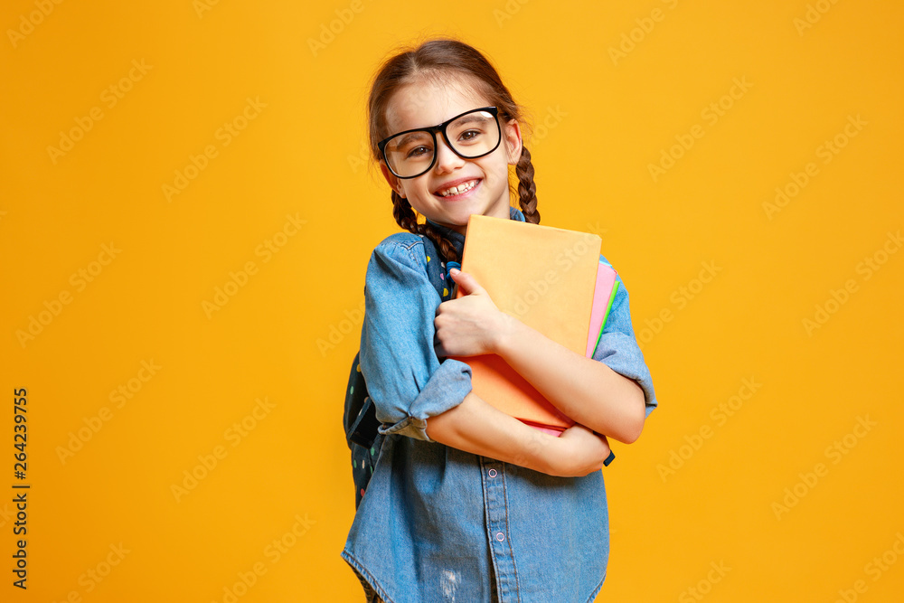 funny child school girl girl on yellow background    . - obrazy, fototapety, plakaty 