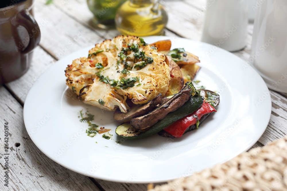A healthy vegetable diet. Cauliflower with mushrooms baked potatoes. Vegetarian cooking A healthy vegetable diet. Cauliflower with mushrooms baked potatoes. Vegetarian cooking