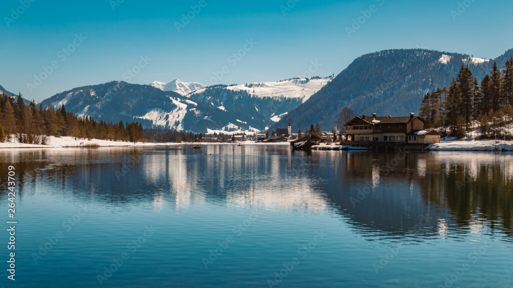 Beautiful alpine winter view with reflections at the famous Piller lake-Tyrol-Austria