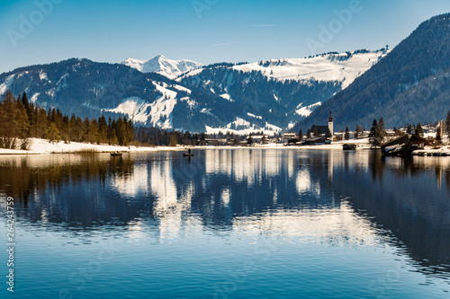 Beautiful alpine winter view with reflections at the famous Piller lake-Tyrol-Austria