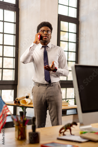 Handsome young man making an appointment with his client