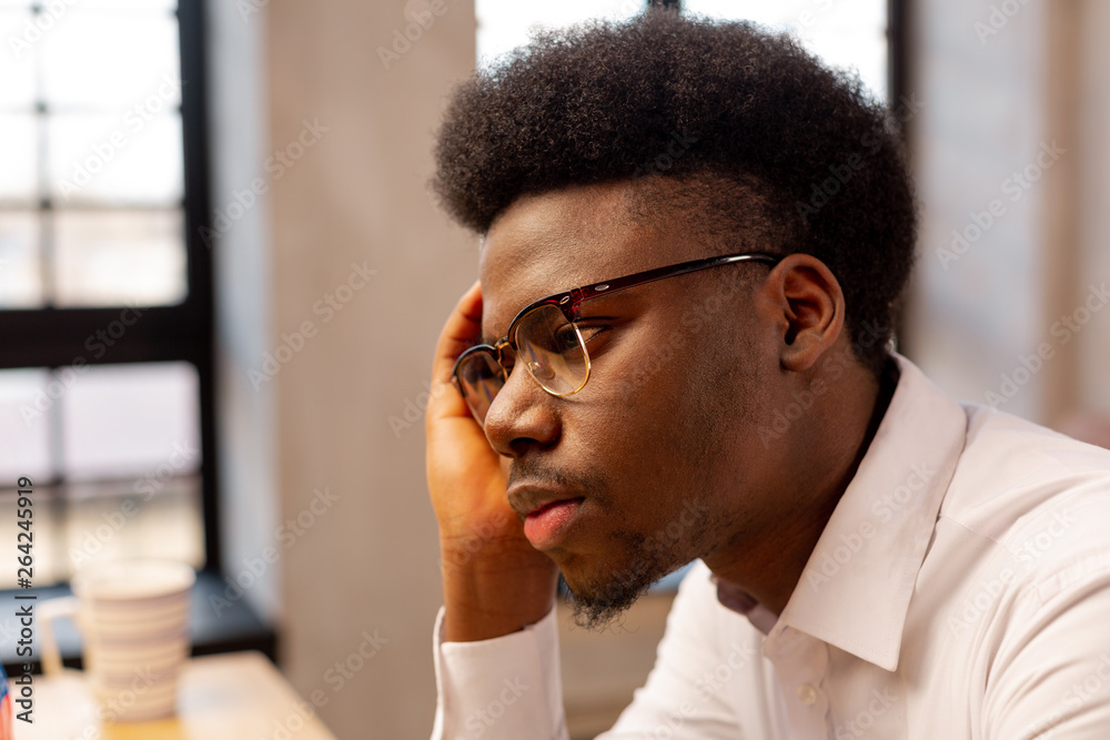 Portrait of a serious cheerless young man Portrait of a serious cheerless young man