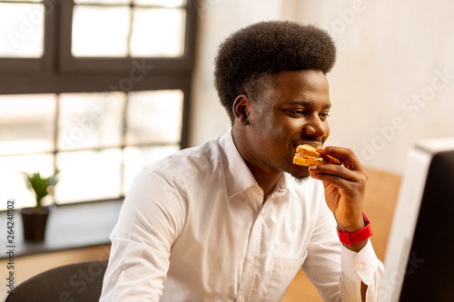 Nice African American man feeling very hungry