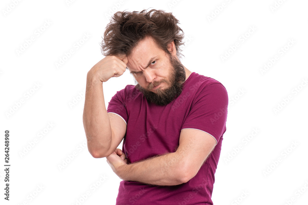 Crazy serious bearded man with confident or displeased expression, keeps arm folded, isolated on white background. Guy with funny Haircut looking in camera with anger. Emotions and signs concept. Crazy serious bearded man with confident or displeased expression, keeps arm folded, isolated on white background. Guy with funny Haircut looking in camera with anger. Emotions and signs concept.