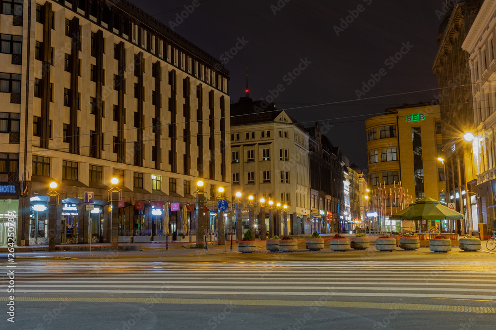 Old Riga the capital of Latvia at night. The business finance center of the city against background of night sky.