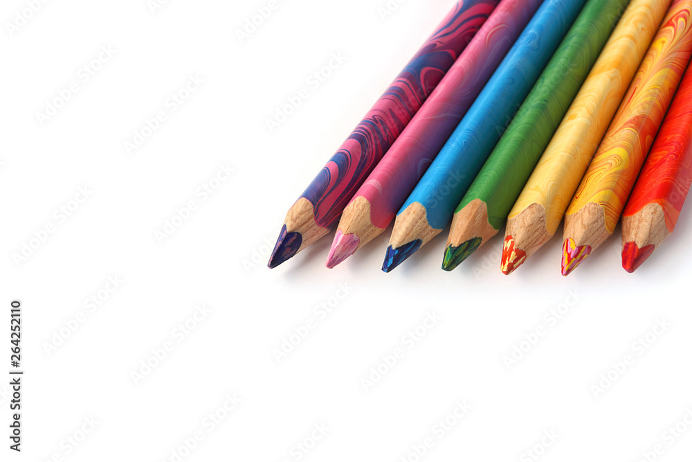 Color pencils on a white background. Spectrum of a rainbow. Back to school. Selective focus, close-up. Color pencils on a white background. Spectrum of a rainbow. Back to school. Selective focus, close-up.