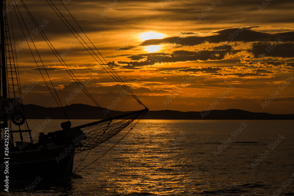 Sunset in Zadar, Dalmatia, Croatia with wooden ship