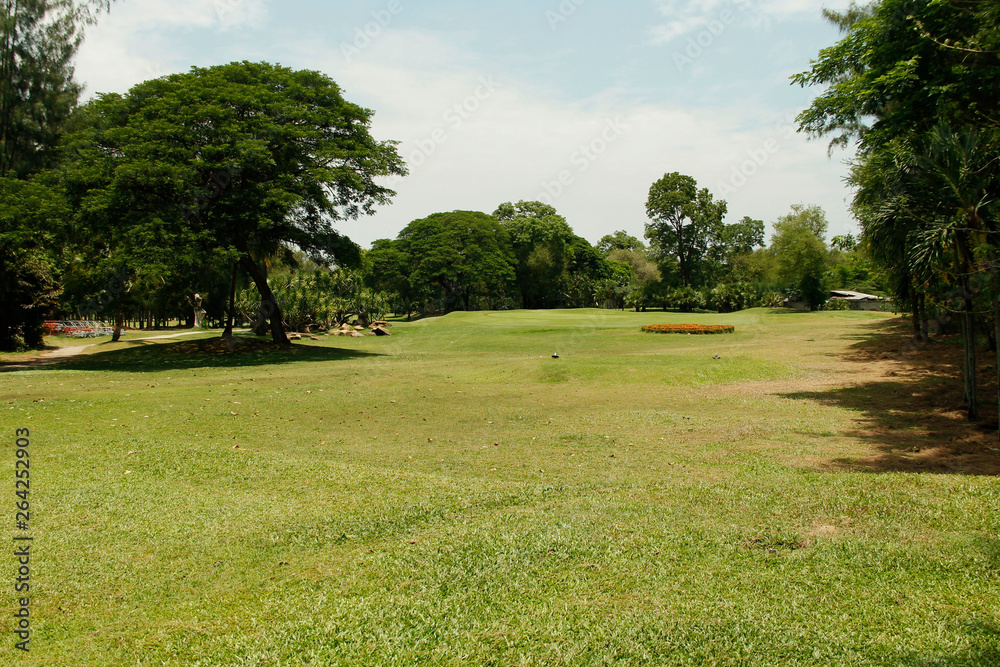 Fototapeta premium The evening golf course has sunlight shining down at golf course in Thailand
