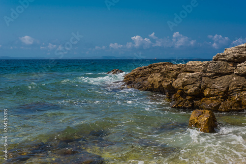 Fototapeta Naklejka Na Ścianę i Meble -  Waves breaking on a stony beach in Murter, Croatia, Dalmatia