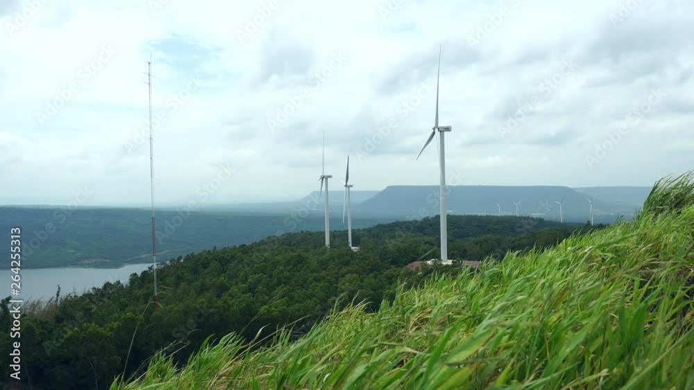 Landscape technology of wind turbine with the nature of the meadow footage 4K