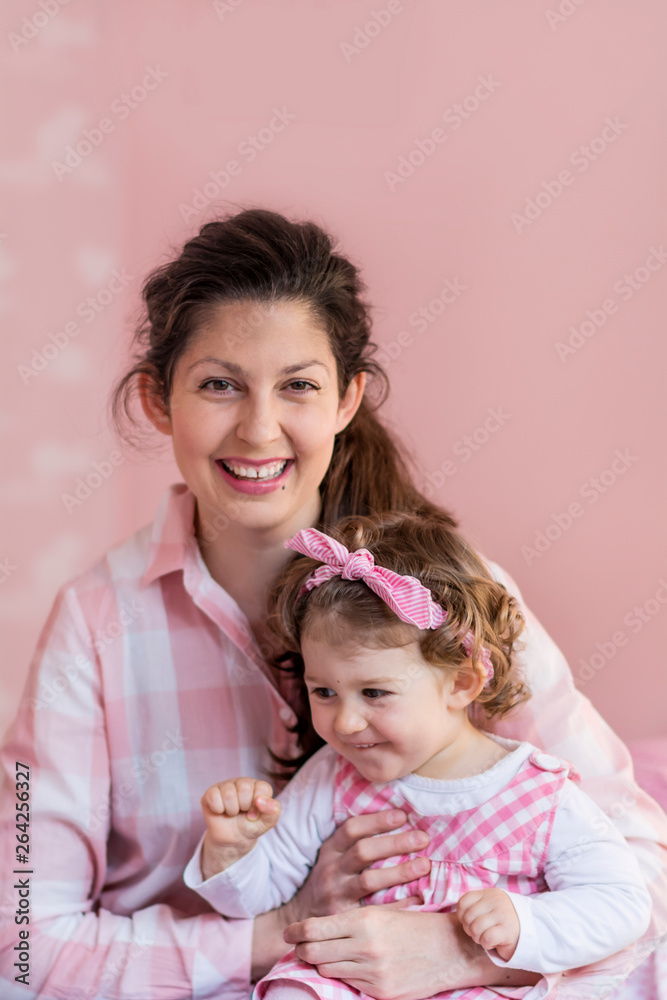 Happy Mother with her Baby Girl Hugging at Home .Mother and Daughter .Happy Family, Mother with Little Child Happy Mother with her Baby Girl Hugging at Home .Mother and Daughter .Happy Family, Mother with Little Child