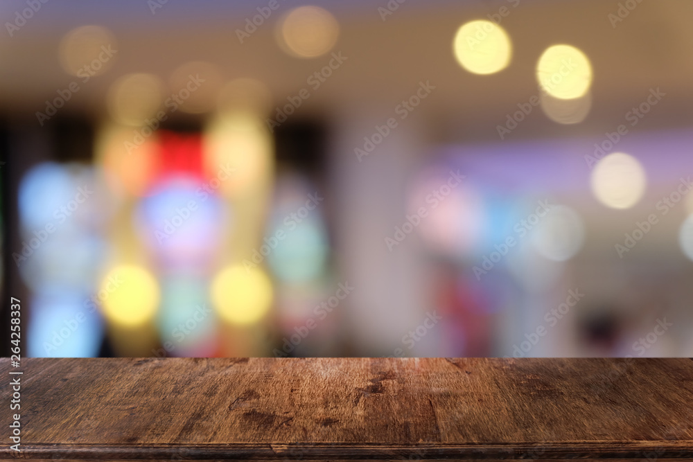 Empty dark wooden table in front of abstract blurred bokeh background of restaurant . can be used for display or montage your products.Mock up for space. Empty dark wooden table in front of abstract blurred bokeh background of restaurant . can be used for display or montage your products.Mock up for space.