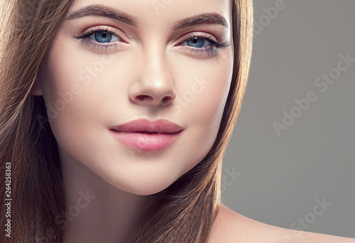 Beautiful brunette woman with long smooth hair beauty hairstyle female portrait