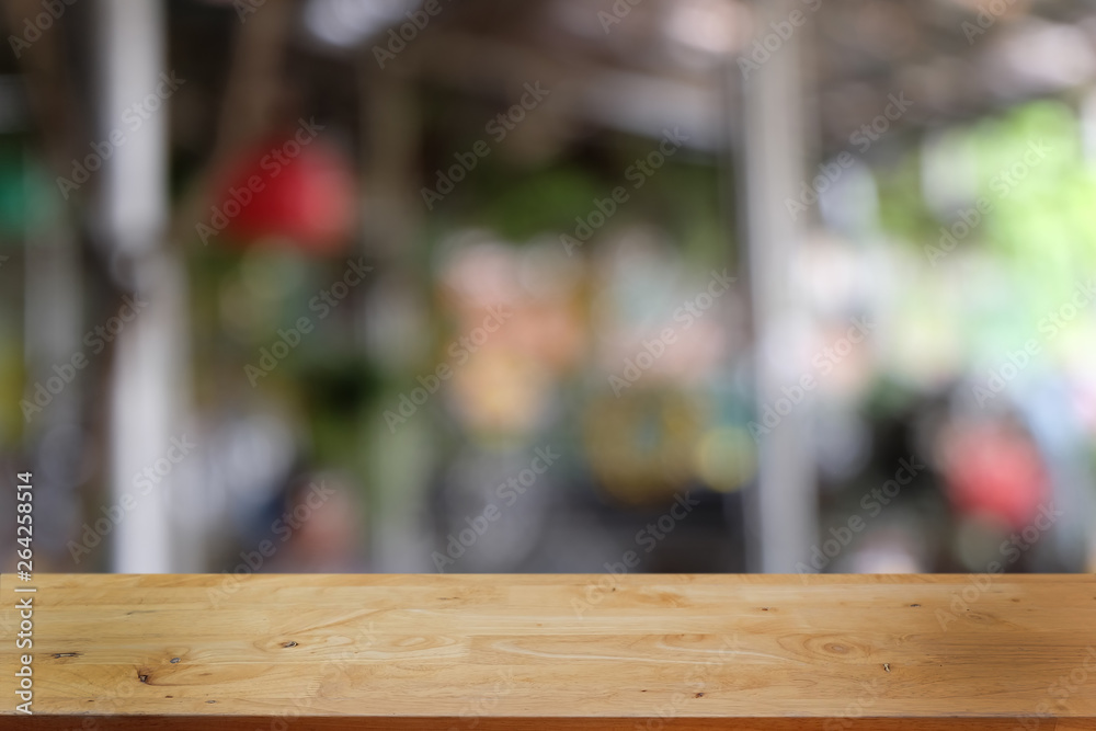 Empty dark wooden table in front of abstract blurred bokeh background of restaurant . can be used for display or montage your products.Mock up for space. Empty dark wooden table in front of abstract blurred bokeh background of restaurant . can be used for display or montage your products.Mock up for space.