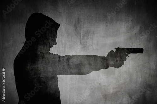 Canvas Print Silhouette von einem Mann mit Pistole