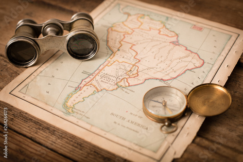 Binoculars and Compass on 1870 Map of South America – World Travel