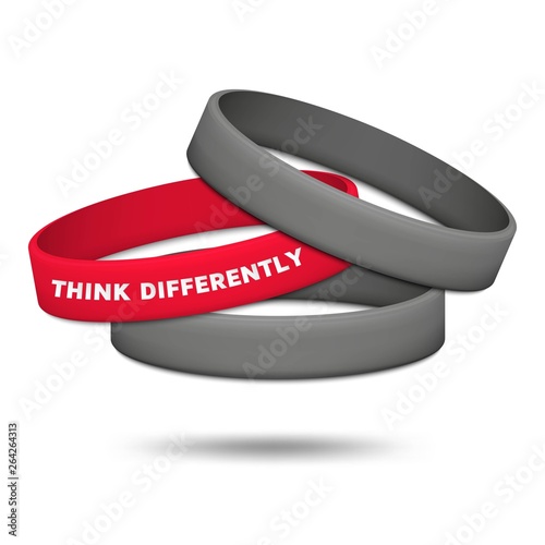 Think differently concept. Be different and individuality. Multicolored rubber wristbands