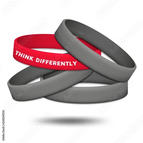 Think differently concept. Be different and individuality. Multicolored rubber wristbands