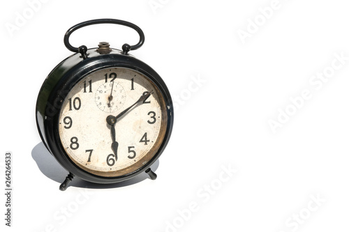 Old alarm clock isolated on white background