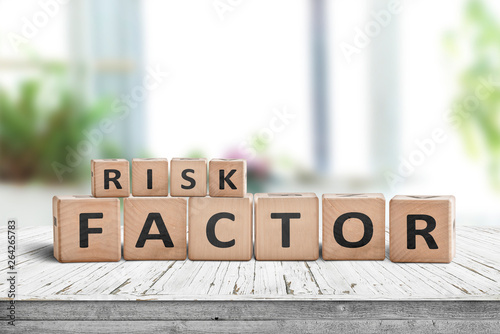 Risk factor sign on a wooden table photo