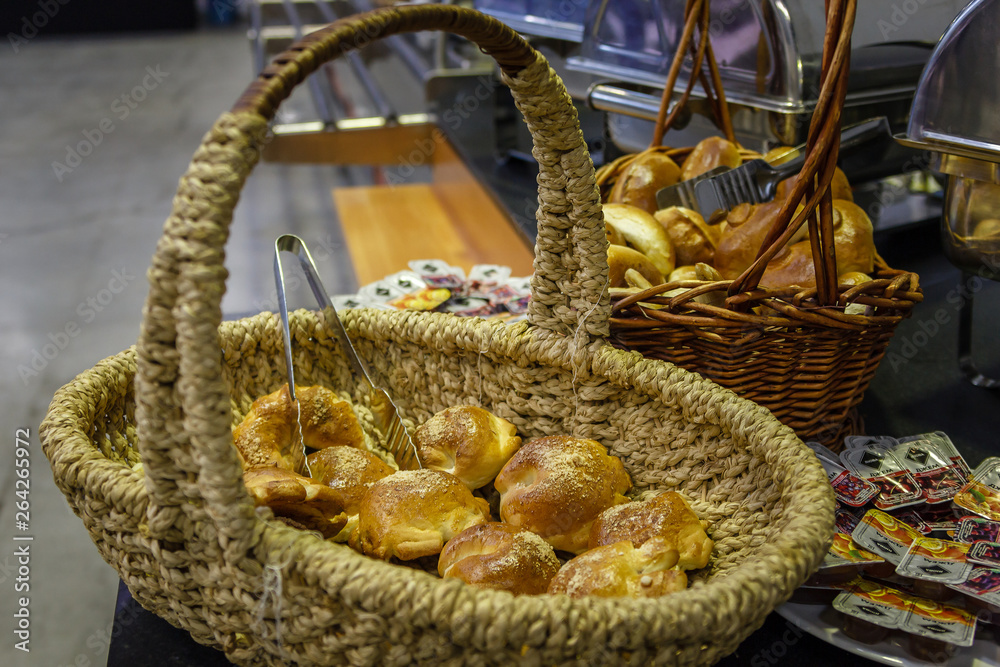 Basket with buns on the dispensing table