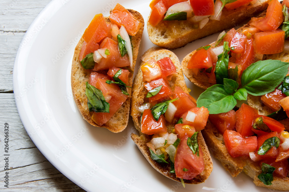 Bruscheta, antipasti Typical Italian with tomato, basil and toast Bruscheta, antipasti Typical Italian with tomato, basil and toast