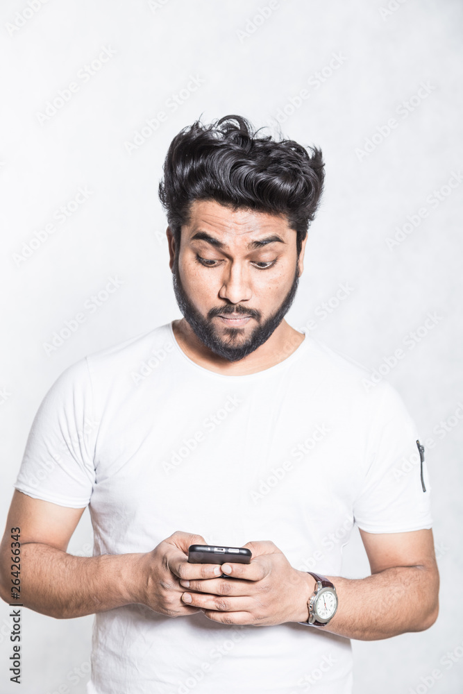 Young handsome man chatting on cell phone. Young handsome man chatting on cell phone.