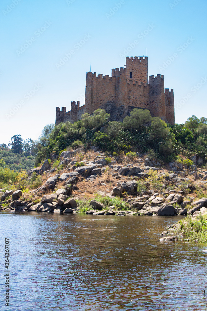 THE RUINS OF A MEDIEVAL CASTLE ALMOUROL ON THE ISLAND IN THE MIDDLE OF RIVER TAGUS (TAJO, TEJO), PORTUGAL THE RUINS OF A MEDIEVAL CASTLE ALMOUROL ON THE ISLAND IN THE MIDDLE OF RIVER TAGUS (TAJO, TEJO), PORTUGAL