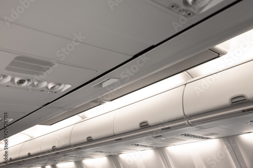 Overhead compartment row of an airplane cabin interior.
