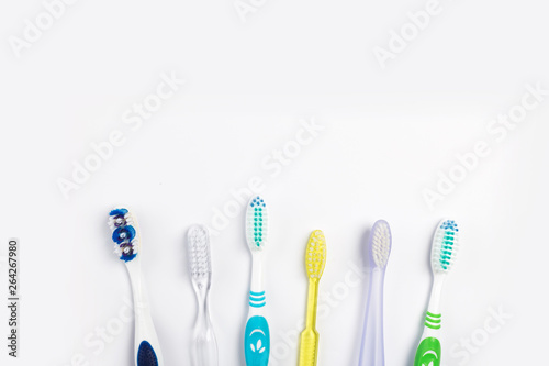 New different  toothbrushes on a white background © Nana_studio
