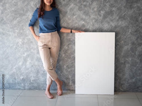Asian woman with white banner copy space
