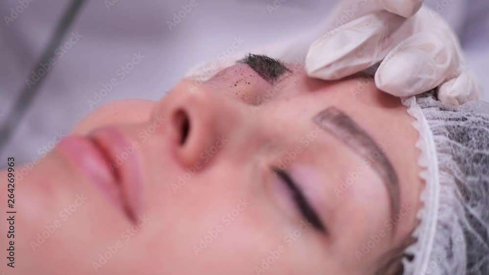 Applying pigment machine on the eyebrow. Permanent makeup. 4K Slow Mo Applying pigment machine on the eyebrow. Permanent makeup. 4K Slow Mo