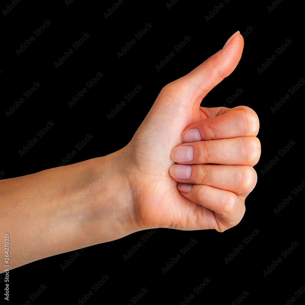 Woman holding hand in gesture of like sign, giving thumb up Woman holding hand in gesture of like sign, giving thumb up