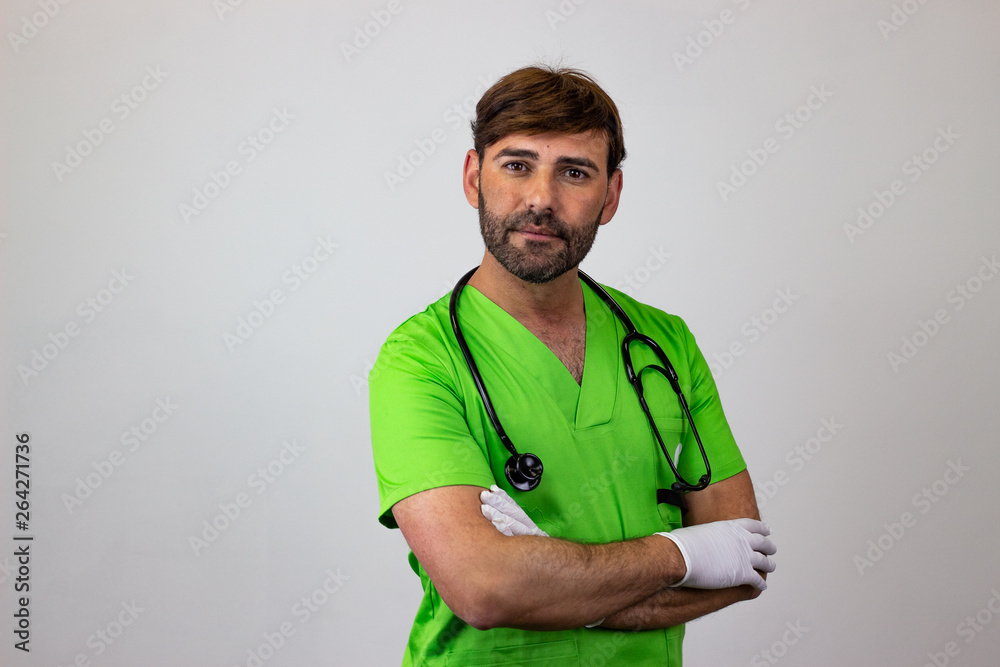 Portrait of male veterinary doctor in green uniform with brown hair quiet, their back facing the camera and looking at the camera. Isolated on white background.