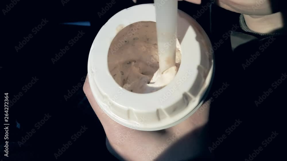 woman eating ice cream spoon, close-up woman eating ice cream spoon, close-up