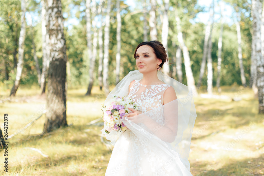 Beautiful girl in a white dress in a birch forest Beautiful girl in a white dress in a birch forest