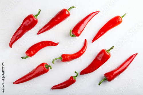 Red pepper pattern on white background. Top view, flat lay, close-up. Ramiro pepper. Food concept.