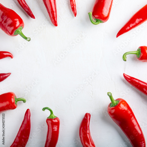 Red pepper frame on white background. Top view, copy space, flat lay, close-up. Ramiro pepper.