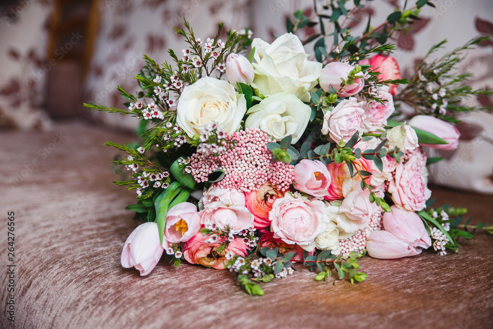 beautiful wedding bouquet of mixed flowers in vase . the work of the florist at a flower shop. copy space