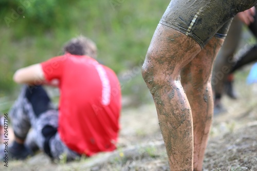 Dirty muddy legs in extreme outdoor race