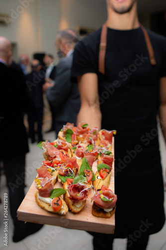 waiter serving food in a party