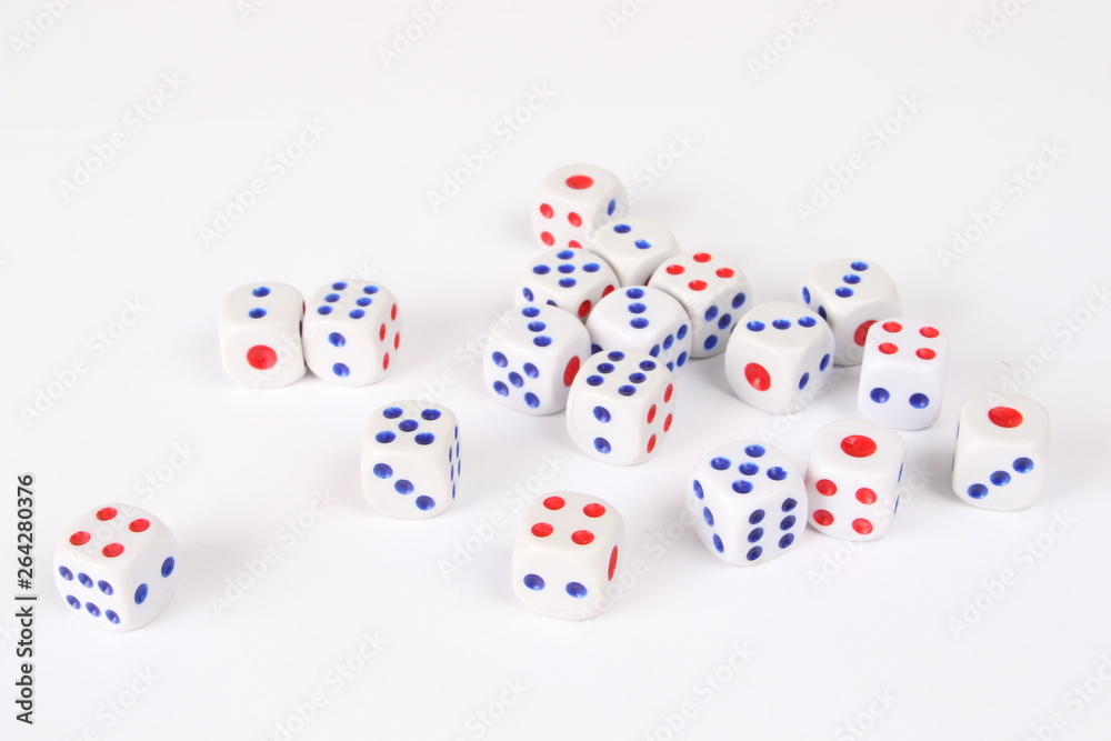 Playing cubes on a white background in the studio. A pile of dice for casinos. Playing cubes on a white background in the studio. A pile of dice for casinos.