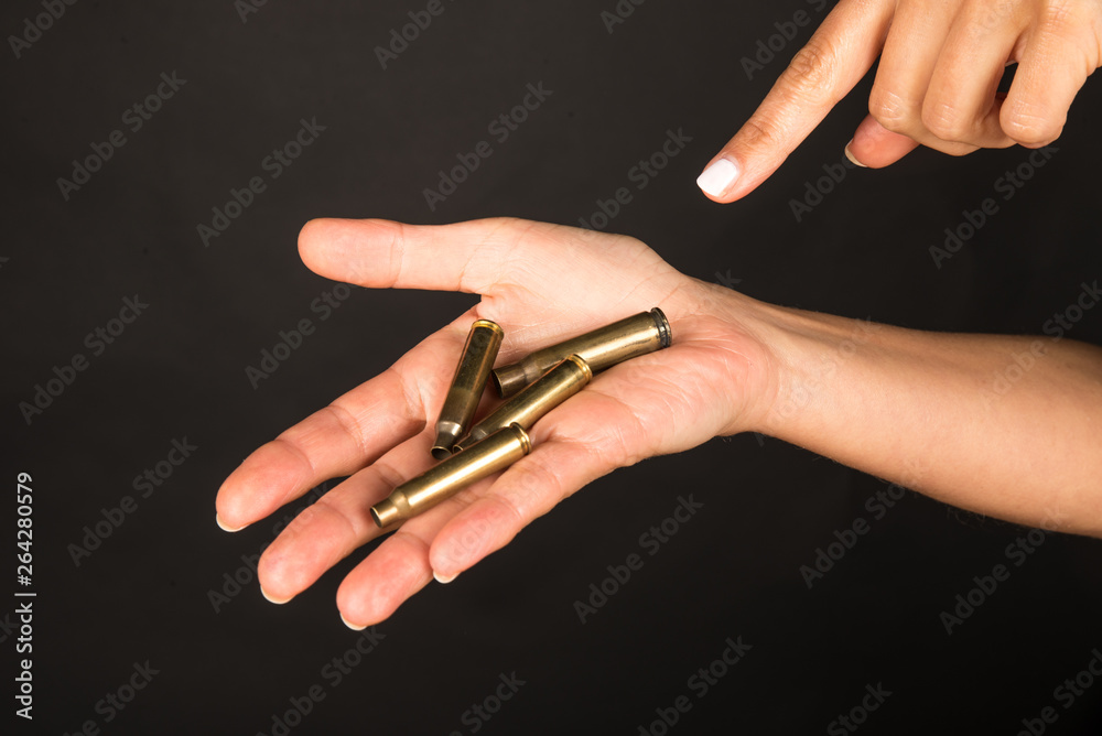 Female hand with bullets