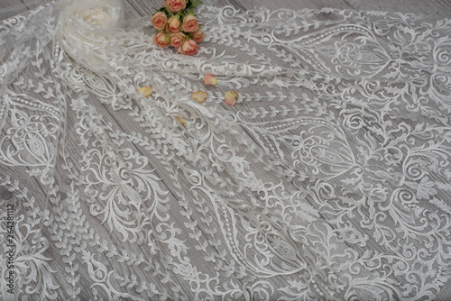 The texture of lace on wooden background decoreted roses. photo