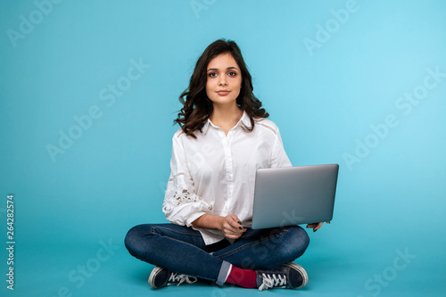 Girl working laptopsitting on the floor © burdun