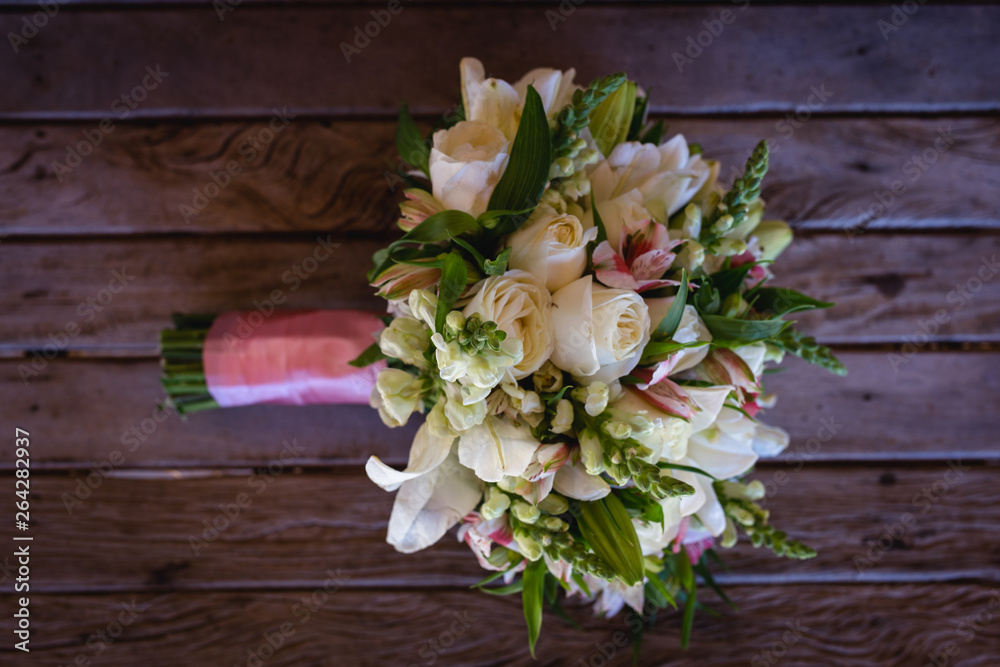 wedding bouquet on wooden table, rustic bouquet for bride. wedding bouquet on wooden table, rustic bouquet for bride.
