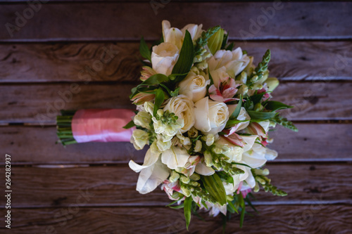 wedding bouquet on wooden table, rustic bouquet for bride. © RHJ