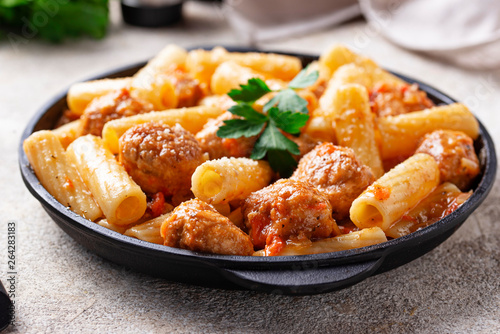 Pasta with meatballs in tomato sauce.
