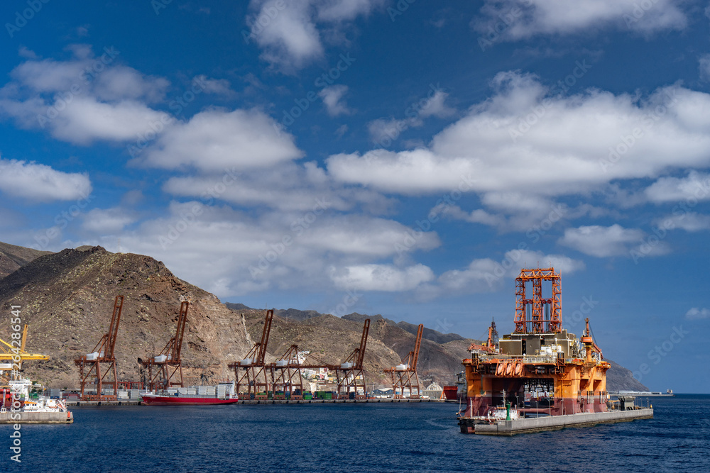 Oil rig platform at dawn in the port of Santa Cruz de Tenerife Canary Islands Spain. Anaga mountains in background