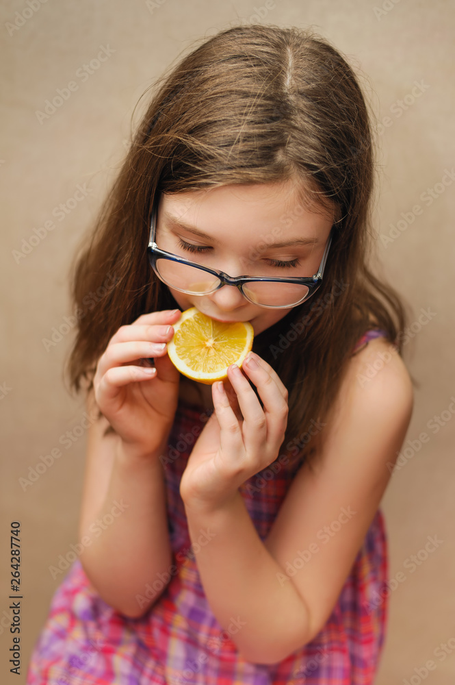 happy smile girl showing slice of lemon happy smile girl showing slice of lemon